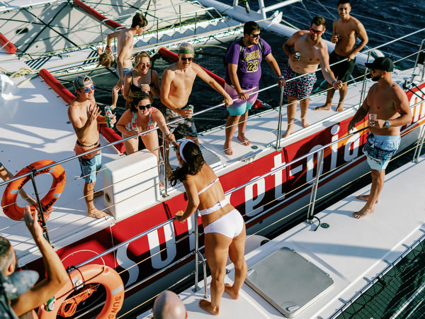 Wedding guests partying on Santorini sailing boat