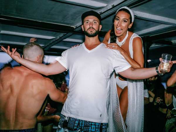 Bride and groom dancing during Santorini wedding boat party