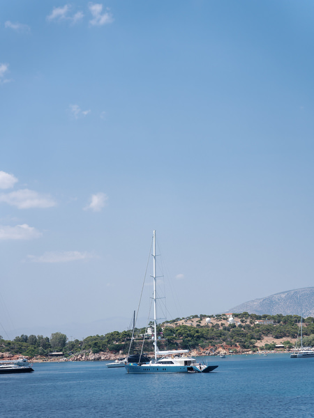 Sailboat off the coast near Four Seasons Astir Palace Athens Riviera.