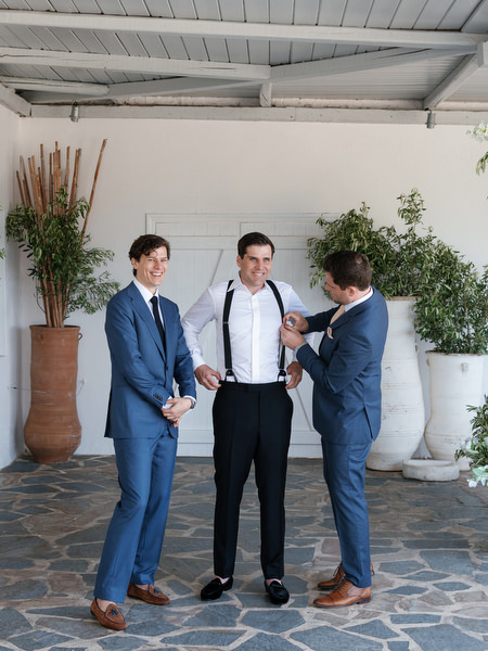 Groom getting ready with groomsmen at Four Seasons Astir Palace Athens.