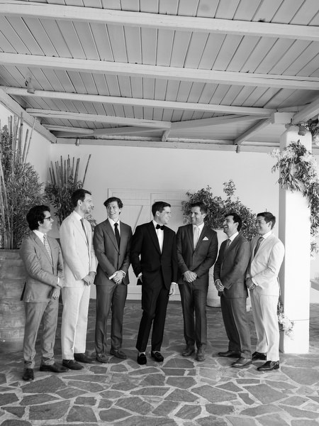 Black and white groom portrait at Four Seasons Astir Palace.