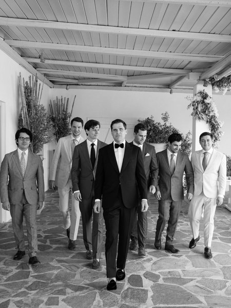 Groom and groomsmen walking at Four Seasons Astir Palace Athens.
