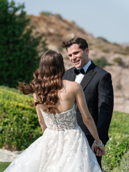 Bride and groom first look at Athens Riviera luxury wedding.