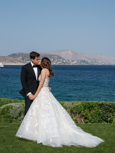 Couple portrait by the sea at Four Seasons Astir Palace Athens.