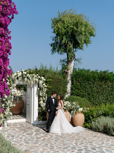 Bride and groom portrait at Island Resort Athens Riviera luxury garden.