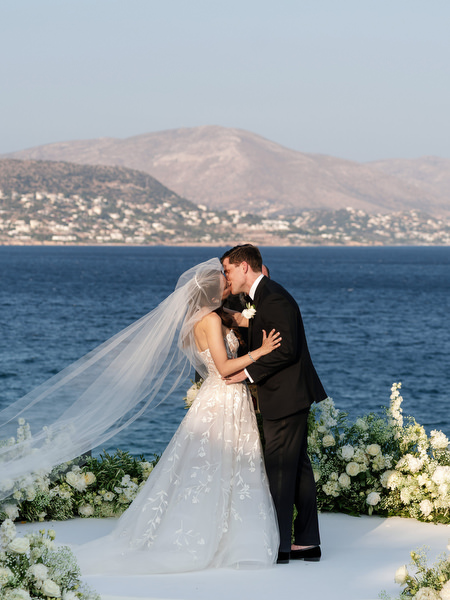 First kiss at The Gallery Island Resort Athens Riviera overlooking the sea.