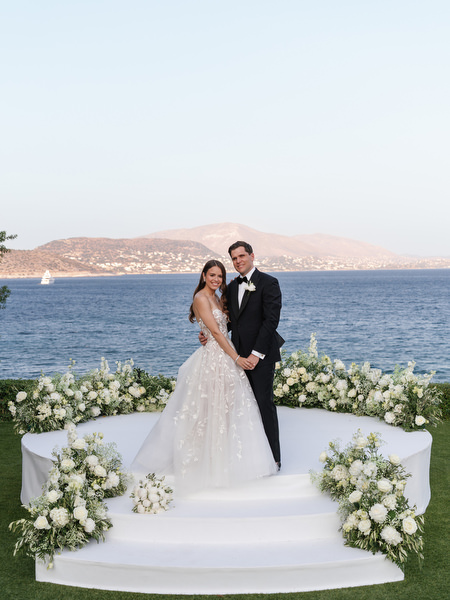 Bride and groom portrait at Island Resort Athens Riviera overlooking the sea.