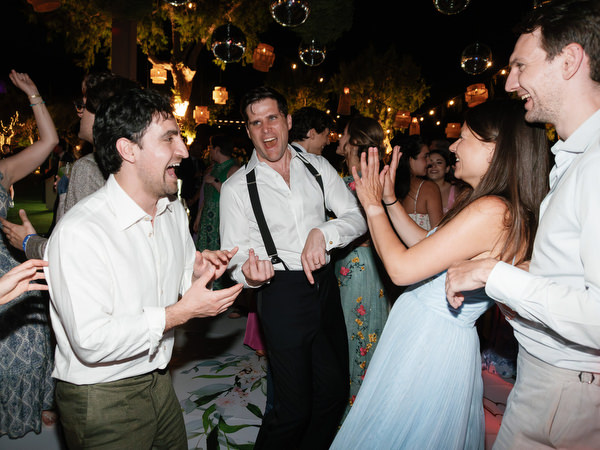 Guests celebrating on dance floor at Island Resort Athens Riviera.
