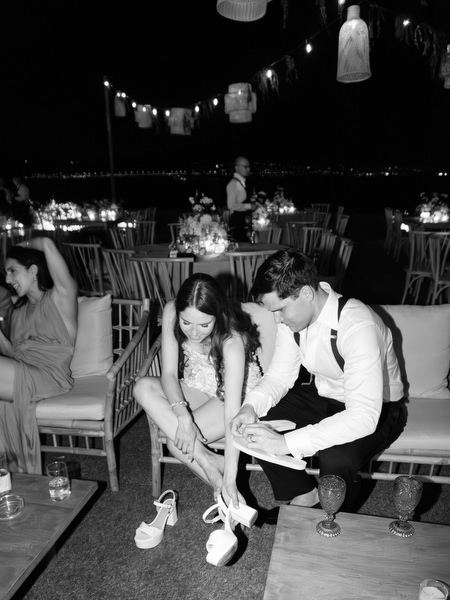 Bride and groom candid moment at Athens Riviera wedding reception.