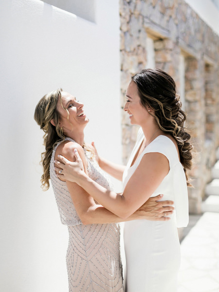 Emotional mother and bride moment before Santorini wedding at Venetsanos Winery.