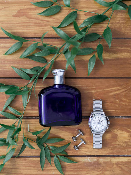 Groom accessories flat lay for Santorini wedding at Venetsanos Winery.