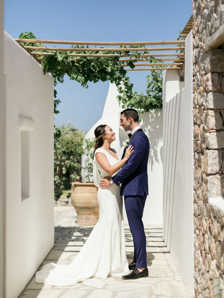 Romantic Santorini couple portrait near Venetsanos Winery wedding venue.