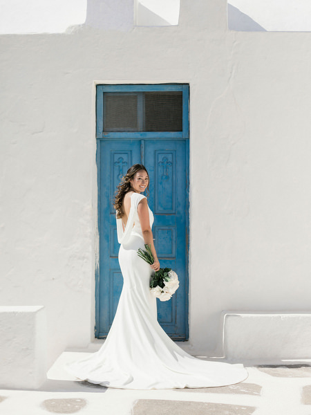 Santorini bride portrait before Venetsanos Winery caldera wedding.