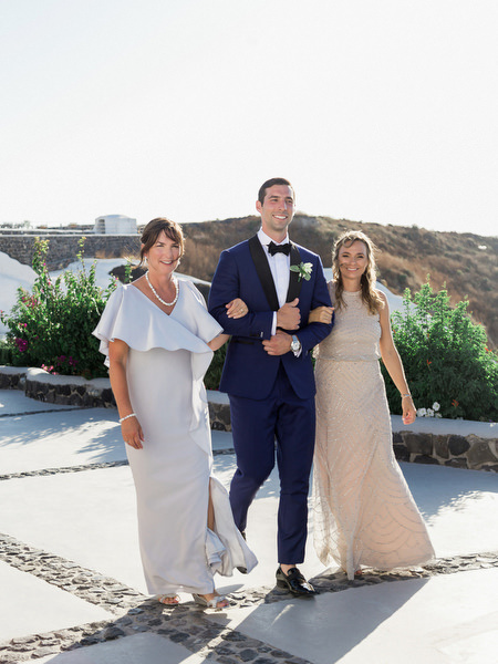 Groom processional at Venetsanos Winery Santorini wedding ceremony.