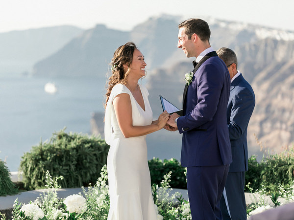 Bride and groom smiling during Venetsanos Winery wedding in Santorini.