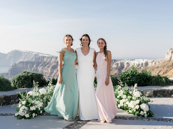 Bride and bridesmaids portrait at Venetsanos Winery Santorini wedding.