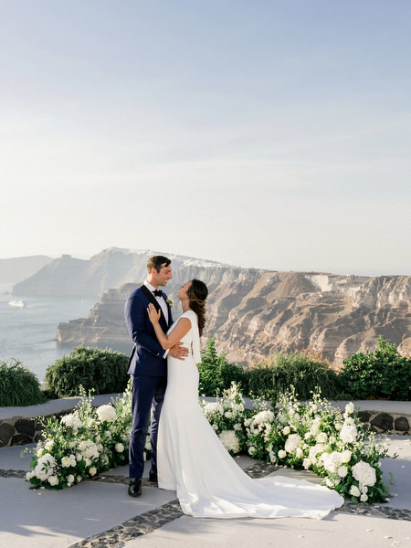 Editorial Santorini caldera wedding portrait at Venetsanos Winery.