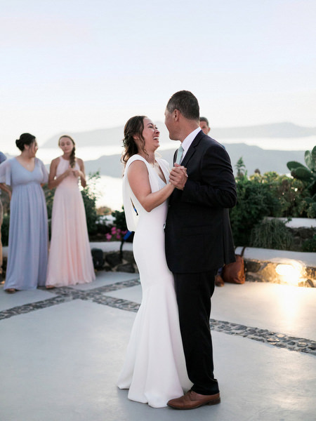Family dance at Venetsanos Winery Santorini destination wedding.
