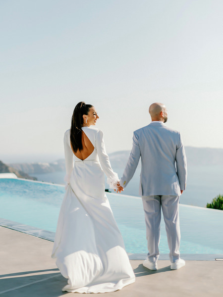 Couple portrait overlooking Aegean Sea during Santorini wedding weekend