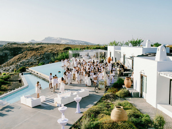 Wedding guests gathering for Santorini welcome party