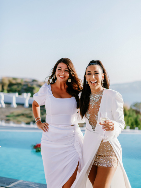 Guests celebrating together at Eros Santorini villa