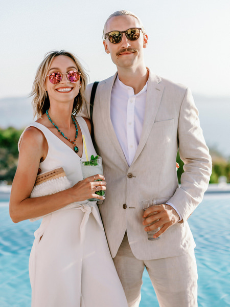 Couple posing during Santorini wedding welcome party