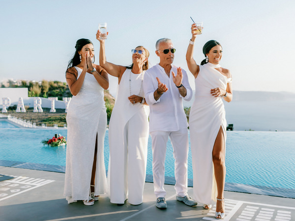 Guests mingling during Santorini wedding welcome celebration