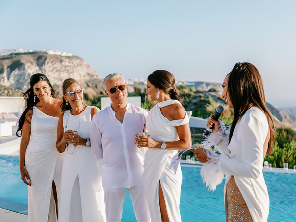 Family speeches during Santorini wedding welcome dinner