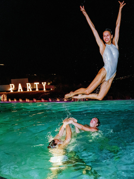 Water performance jump at Santorini wedding welcome party
