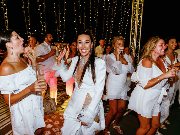 Bride dancing with guests at Santorini wedding welcome event