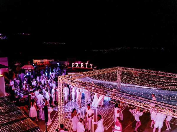 Nighttime celebration at Santorini wedding welcome party