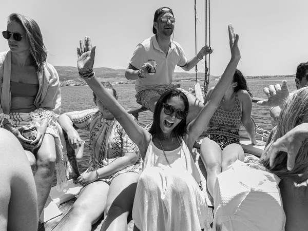 Guests celebrating on deck during Antiparos pre-wedding boat cruise