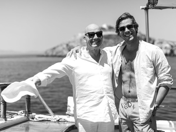 Wedding guests enjoying sunshine during Antiparos pre-wedding boat cruise