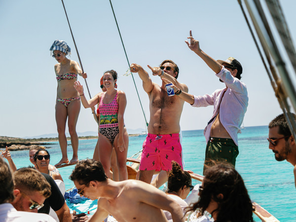 Friends diving into the water during Antiparos pre-wedding boat cruise