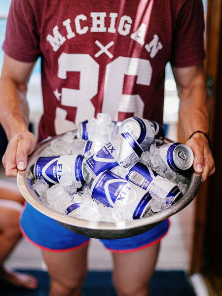 Cold beers served during Antiparos pre-wedding boat cruise celebration
