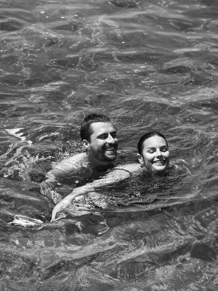Friends floating in sea during Antiparos pre-wedding celebration