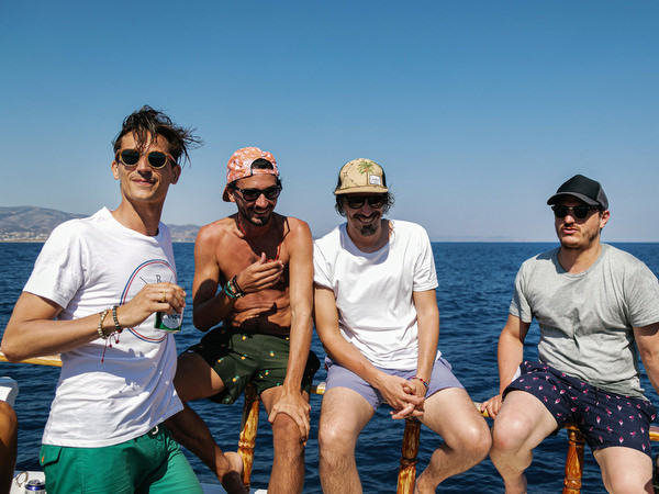 Friends posing together during Antiparos pre-wedding boat cruise