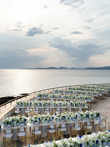 Grand Resort Lagonisi wedding reception setup with white florals tables