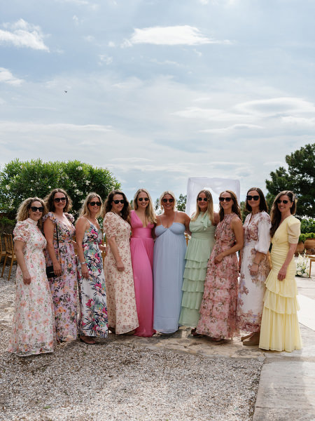 Wedding guests gathered before the outdoor ceremony at Pyrgos Ralli in Aegina