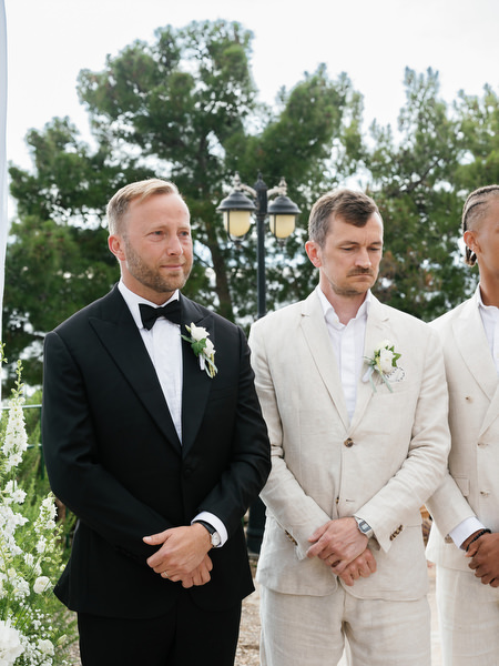 Groom and groomsman waiting for the ceremony to begin at Pyrgos Ralli