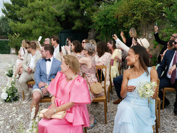 Emotional wedding guests watching the outdoor ceremony at Pyrgos Ralli