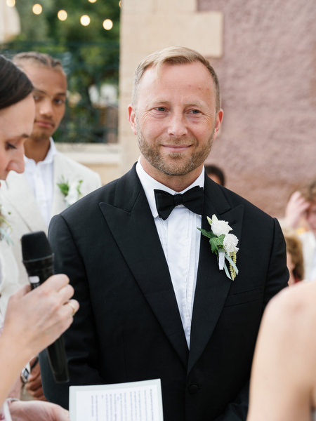 Close-up portrait of the groom during the wedding ceremony at Pyrgos Ralli