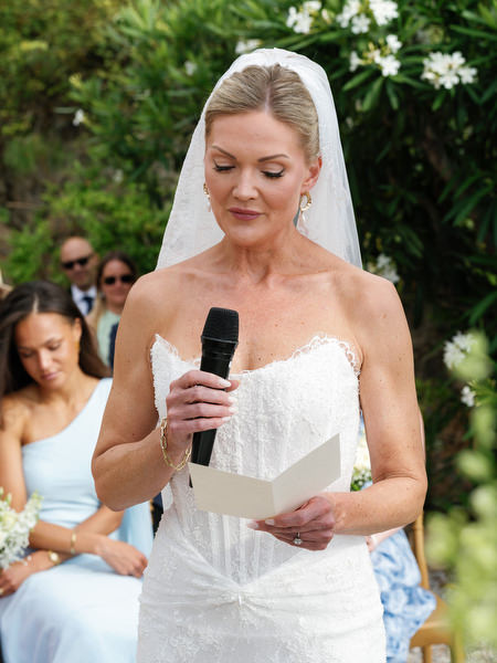 Bride reading her vows during an emotional wedding ceremony in Aegina