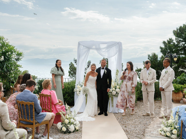 Bride and groom celebrating just after their outdoor wedding ceremony in Aegina