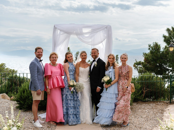 Family and wedding party group portrait after the ceremony at Pyrgos Ralli