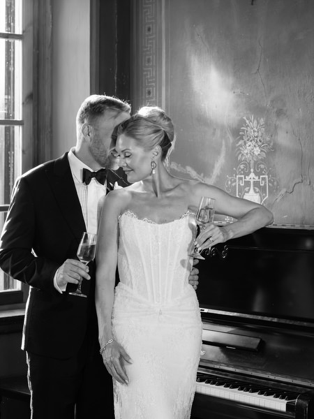 Black and white close-up of the bride and groom embracing inside Pyrgos Ralli