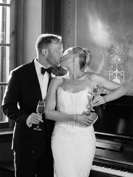 Black and white intimate portrait of the newlyweds inside the historic Aegina wedding venue