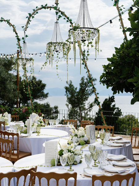 Romantic reception table styling with white flowers and Mediterranean details