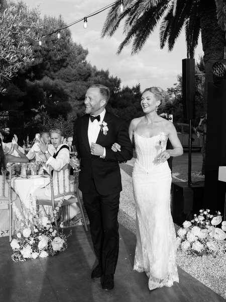 Black and white portrait of the bride and groom standing together at Pyrgos Ralli