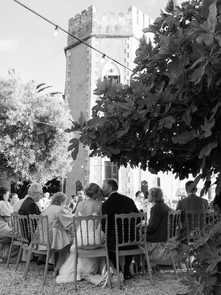 Black and white view of the bride and groom during their outdoor wedding dinner
